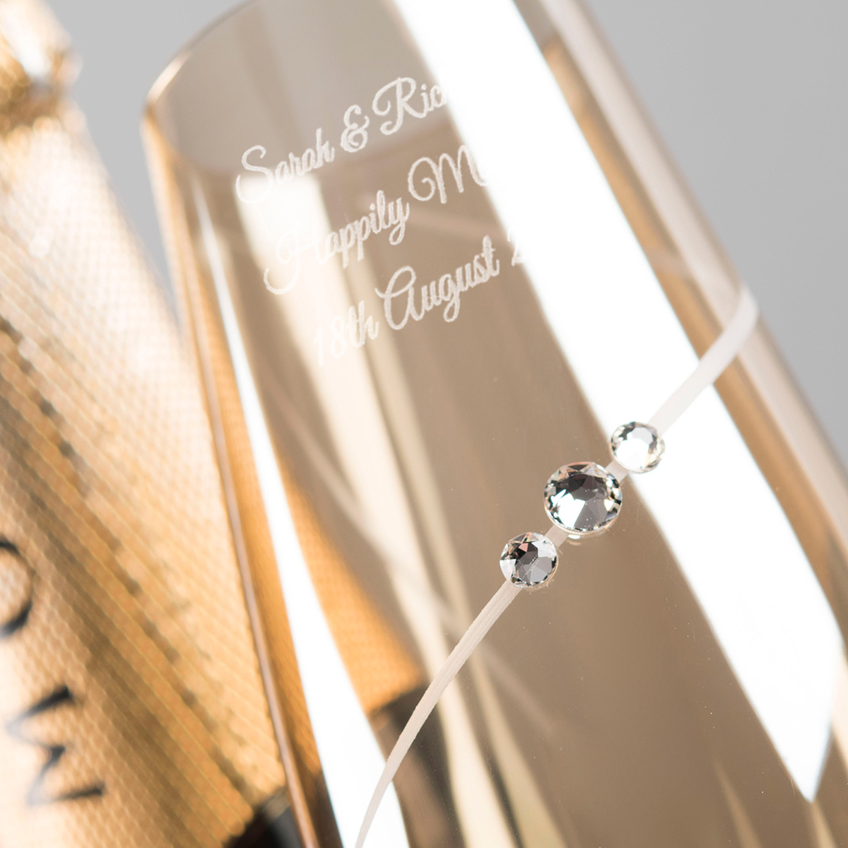 Engraved Set of Two Amber Champagne Flutes embellished with Crystals -  Includes Laurent Perrier Champagne